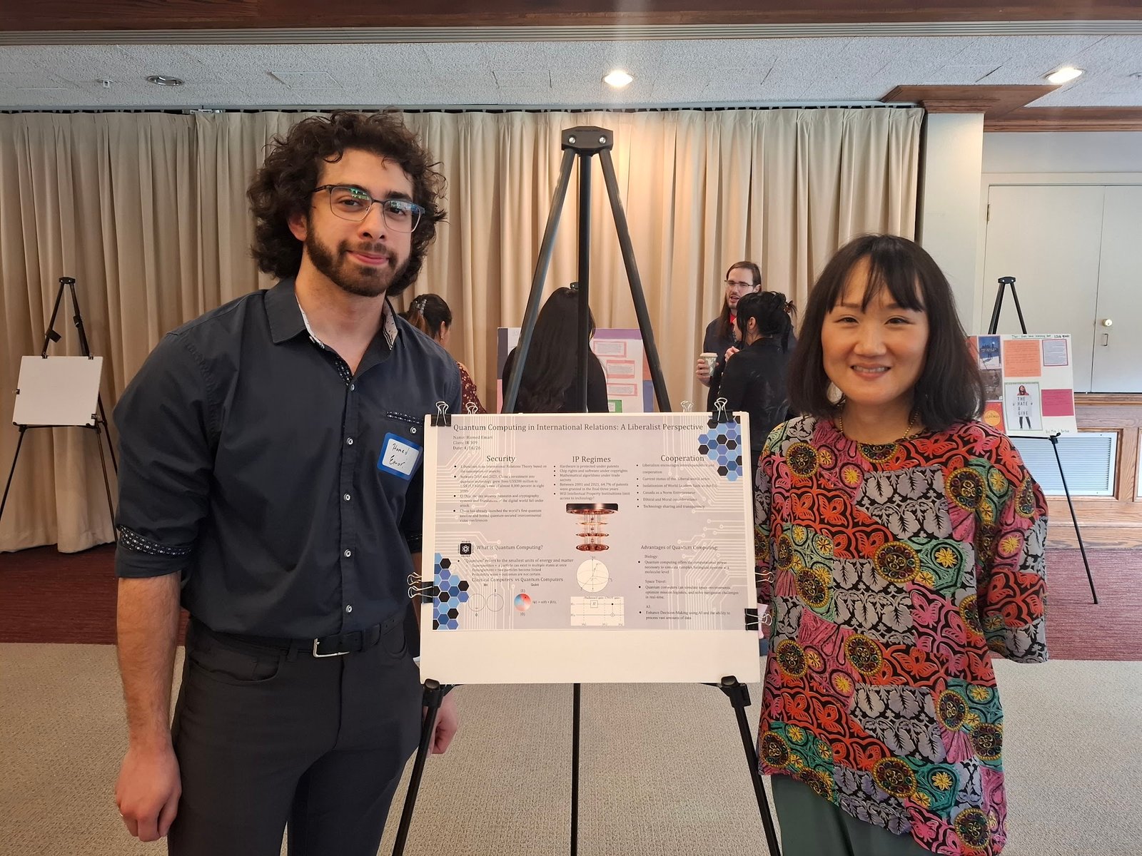 Hamed Emari presenting his Quantum Computing in International Relations research poster